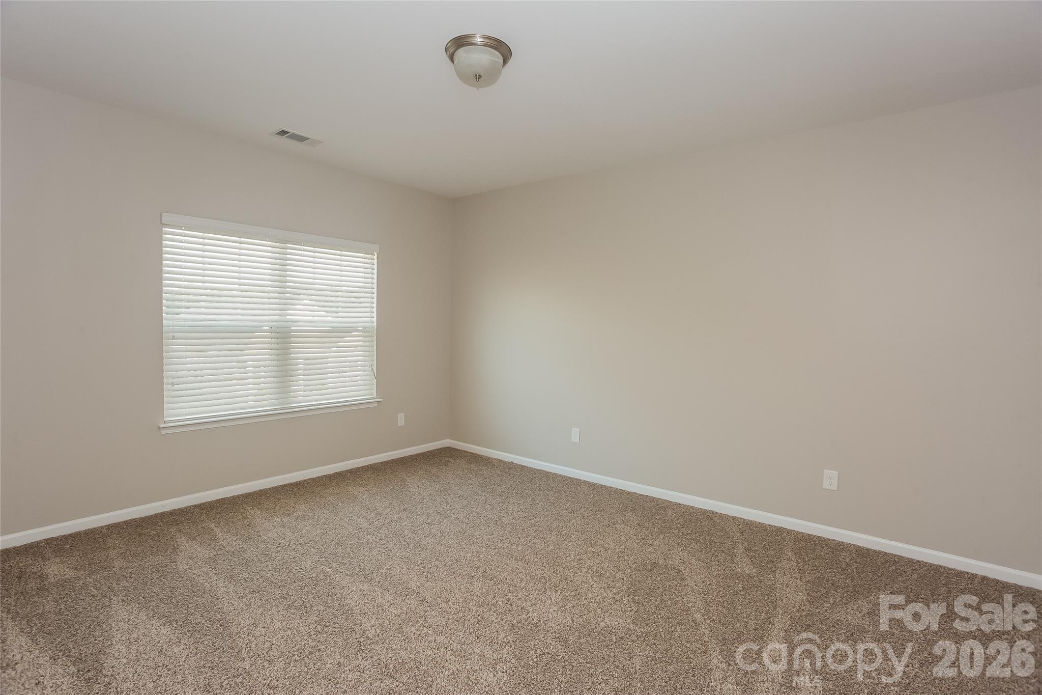 288 Harrison Lane Locust, NC 28097 - Photo 9 of 15 an empty room with a window