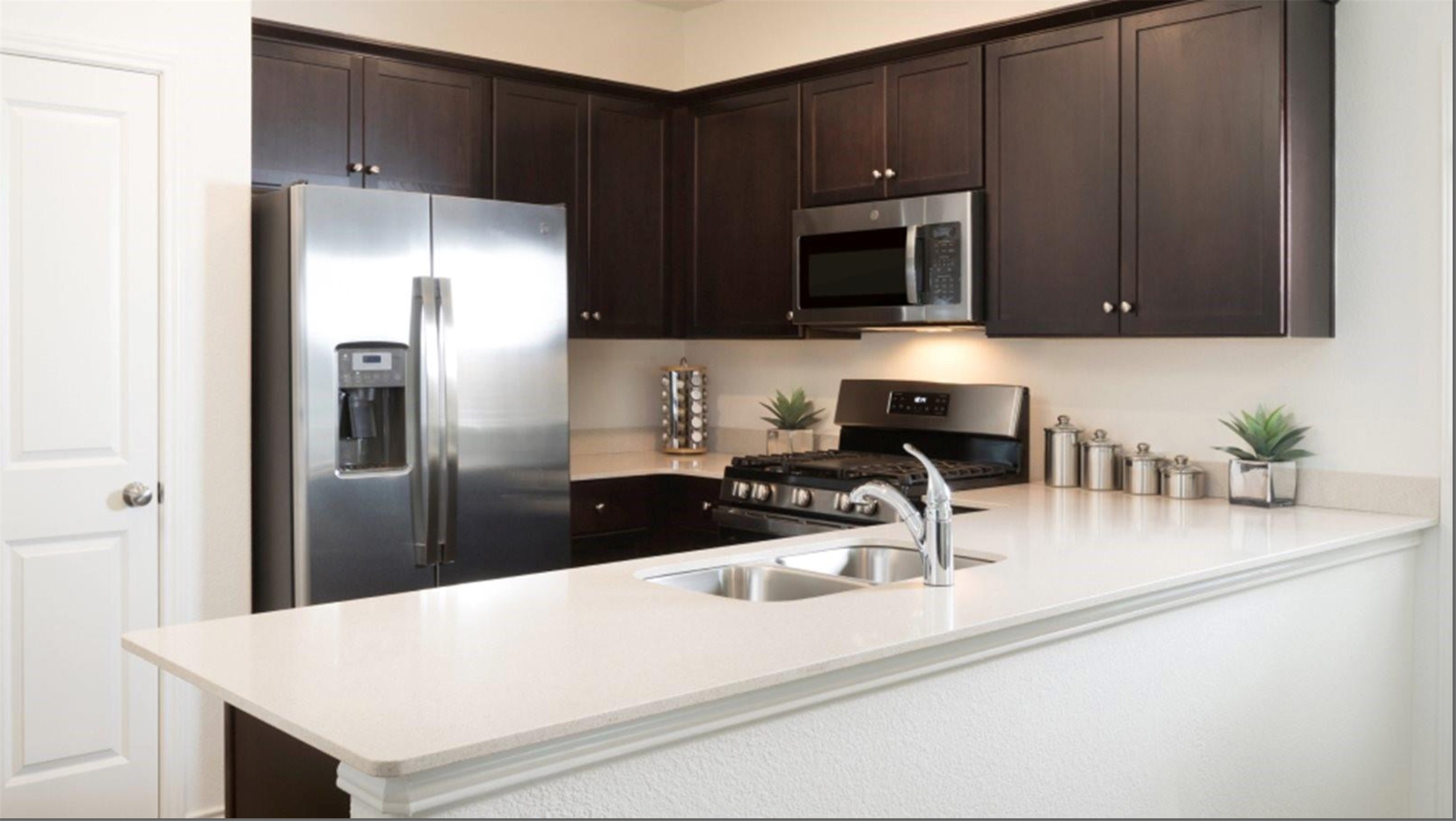 2321 Forgetmenot Lane Manor, TX 78653 - Photo 9 of 27 Culinary aspirations find their home in this well-appointed kitchen featuring a functional breakfast bar and modern appliances.