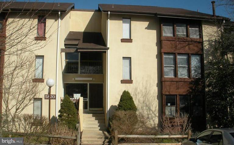 5870 Thunder Hill Road, Unit C4 Columbia, MD 21045 - Photo 1 of 1 a front view of a house with garage