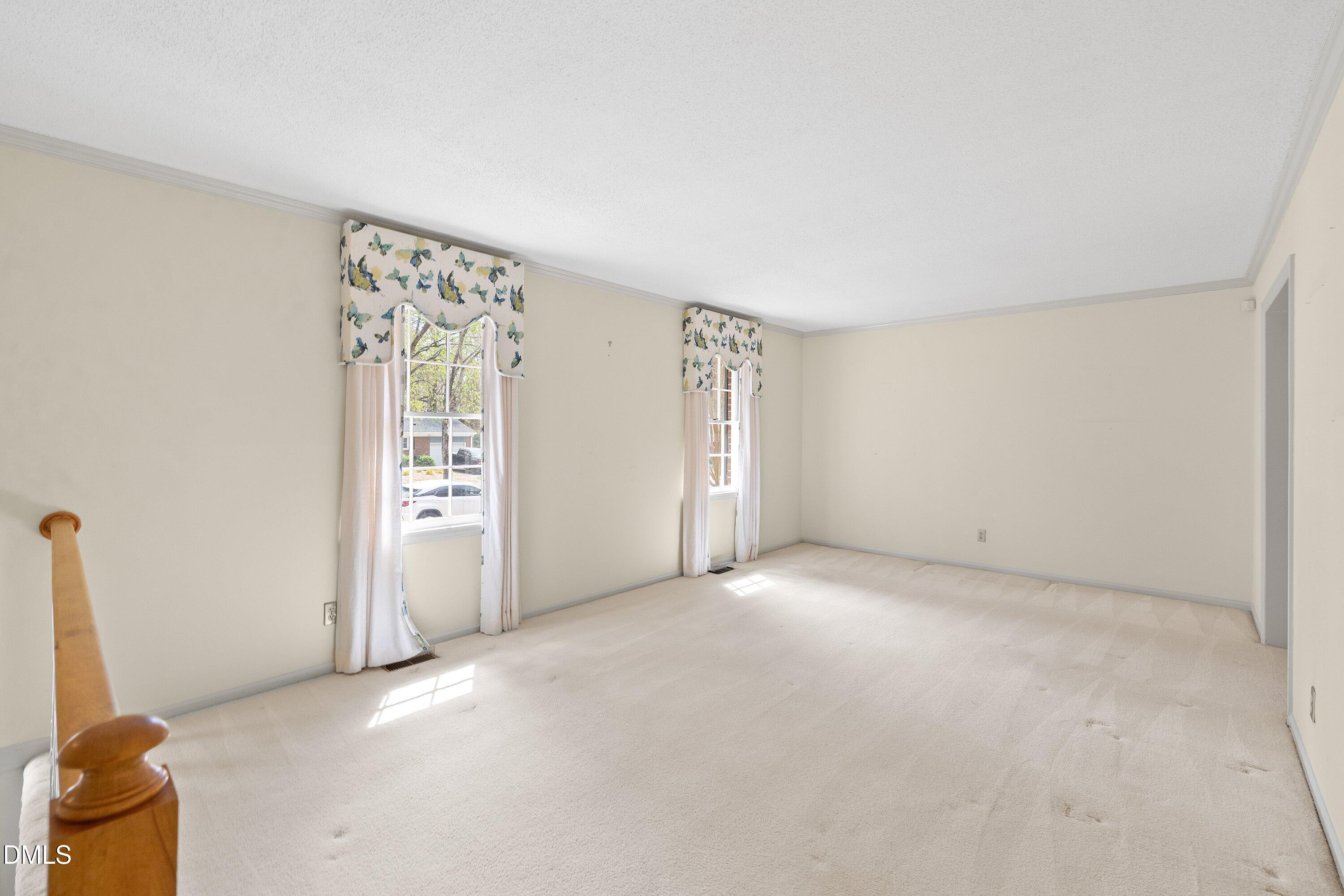 1429 Falls Church Road Raleigh, NC 27609 - Photo 21 of 60 an empty room with windows