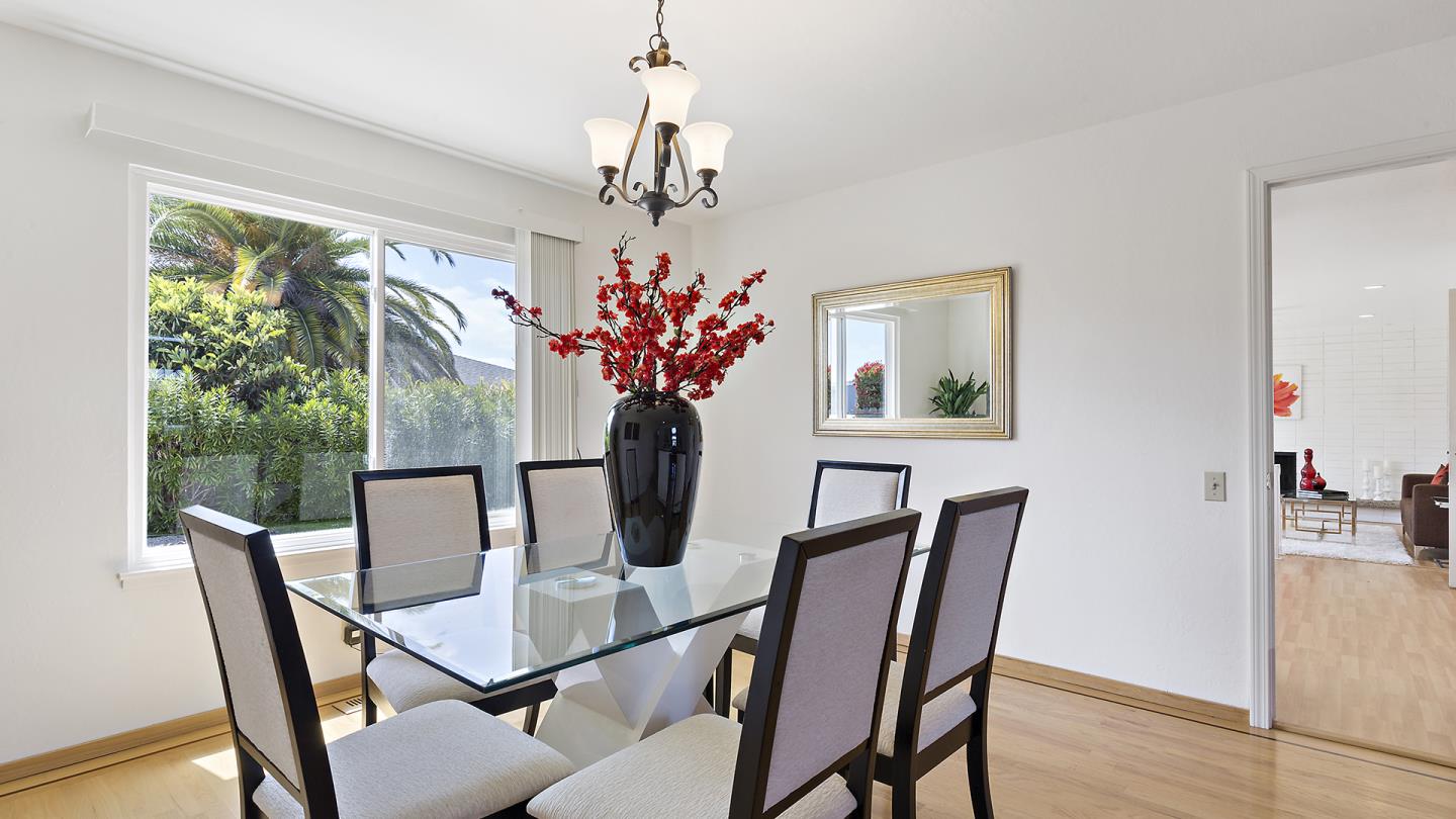 755 Ranger Circle Foster City, CA 94404 - Photo 11 of 45 a view of a dining room with furniture window and wooden floor