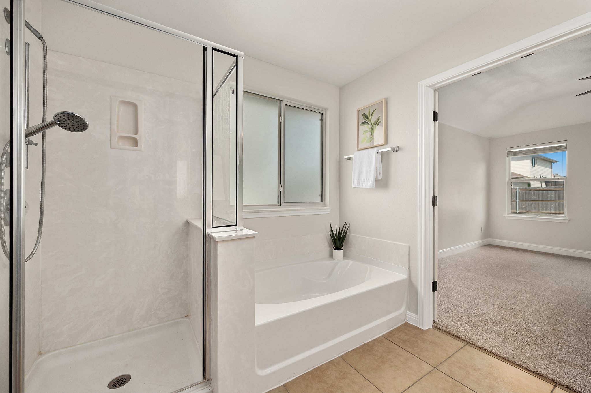 7817 Squirrel Hollow Drive Georgetown, TX 78628 - Photo 22 of 28 a white bath tub sitting next to a shower