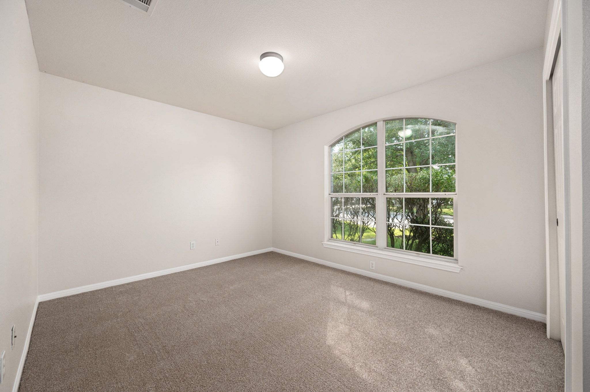 7817 Squirrel Hollow Drive Georgetown, TX 78628 - Photo 25 of 28 an empty room with a window
