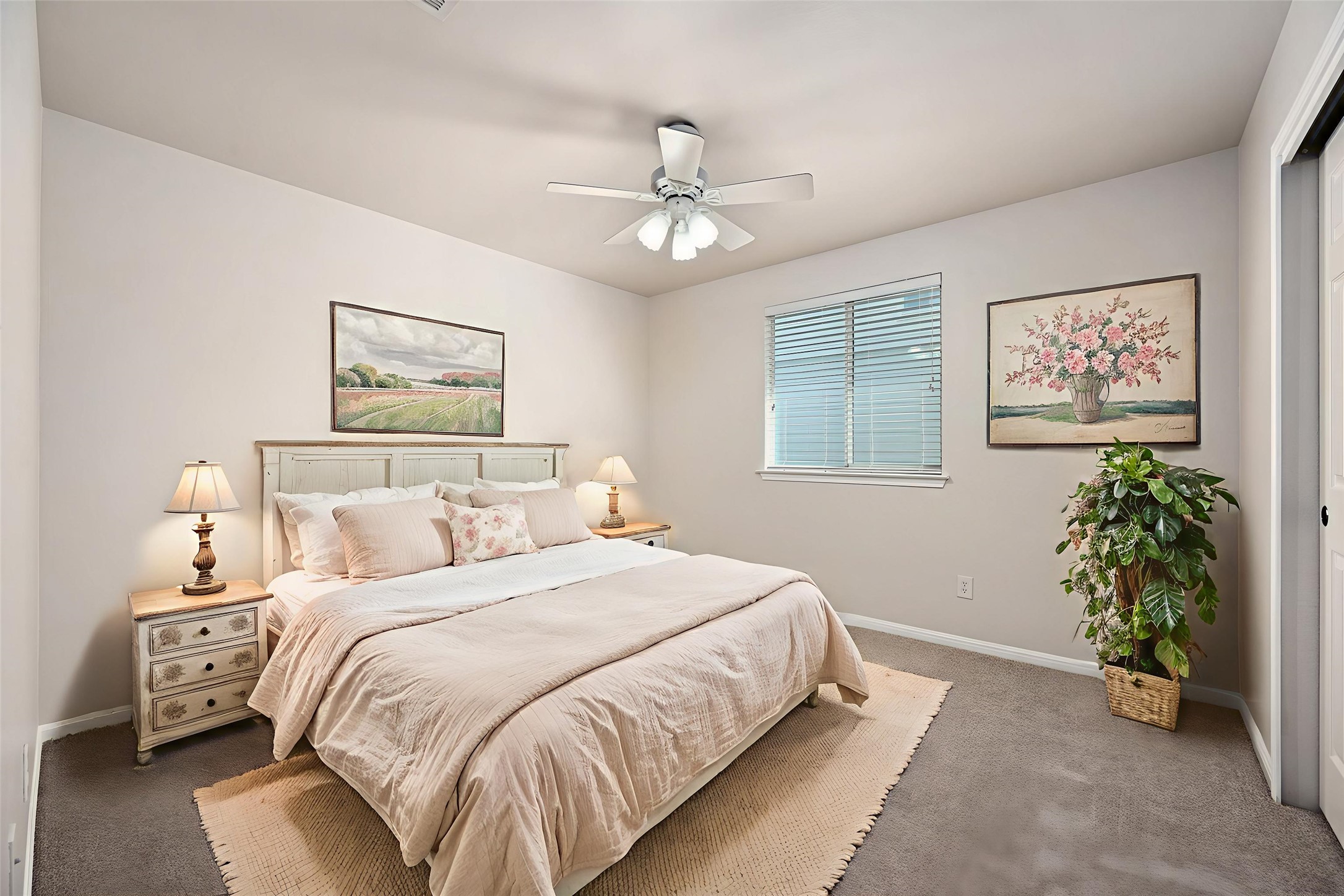 7817 Squirrel Hollow Drive Georgetown, TX 78628 - Photo 26 of 28 a bedroom with a bed and a potted plant
