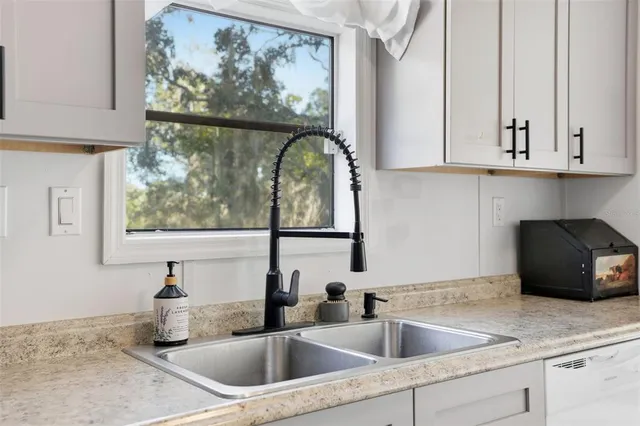 a stove top oven sitting inside of a kitchen