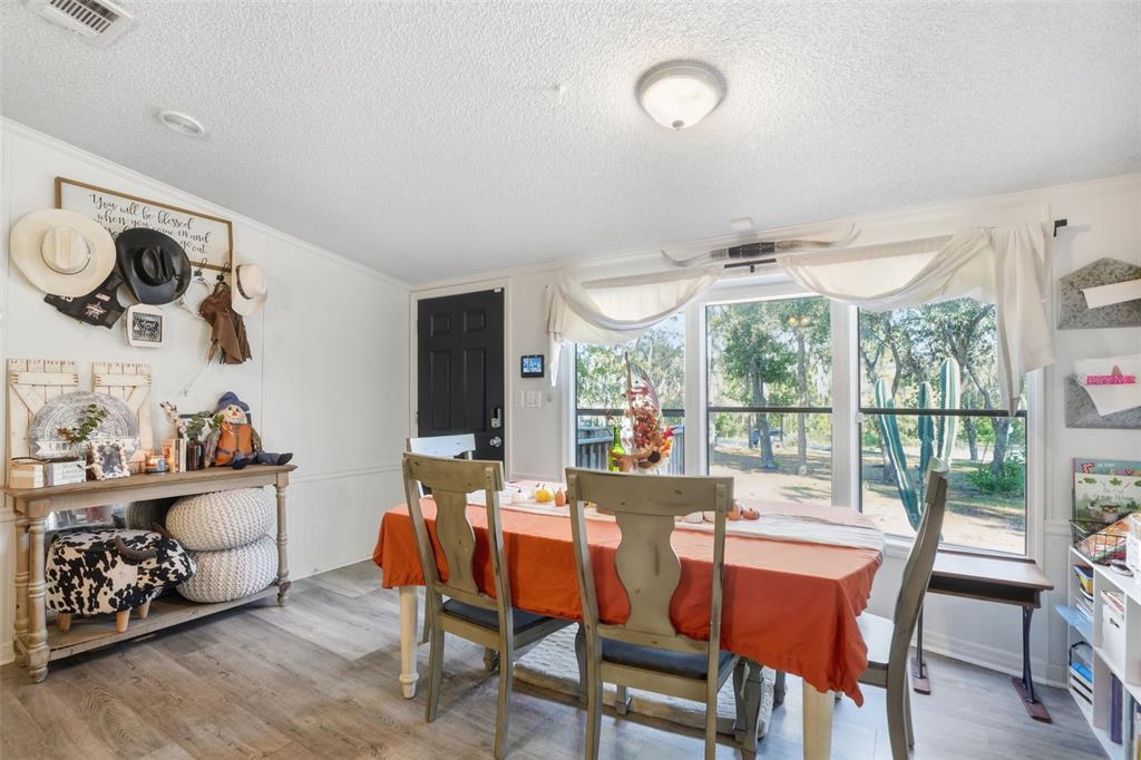 17539 Edwin Terrace Hudson, FL 34667 - Photo 19 of 38 a view of a dining room with furniture window and outside view