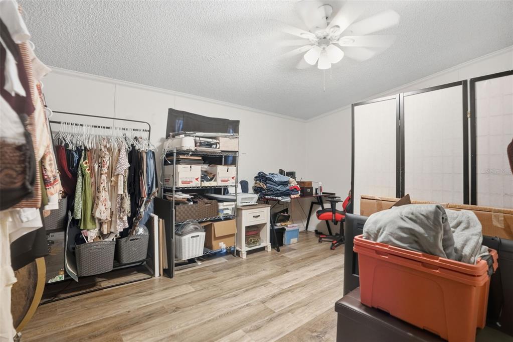 17539 Edwin Terrace Hudson, FL 34667 - Photo 20 of 38 a living room with furniture and a flat screen tv
