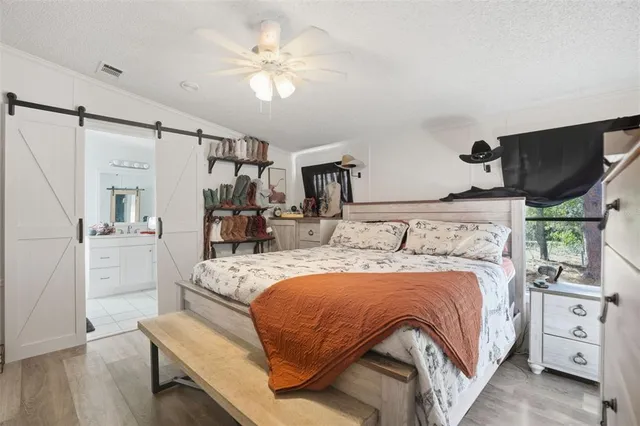 a bedroom with a bed and a tv