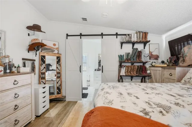 a bedroom with a bed and a dresser