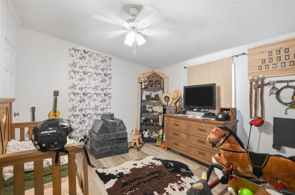 17539 Edwin Terrace Hudson, FL 34667 - Photo 24 of 38 a living room with furniture and a flat screen tv