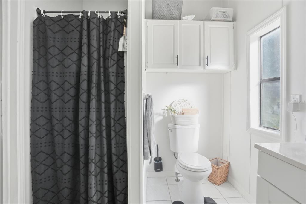 17539 Edwin Terrace Hudson, FL 34667 - Photo 28 of 38 a white toilet sitting next to a bathroom sink