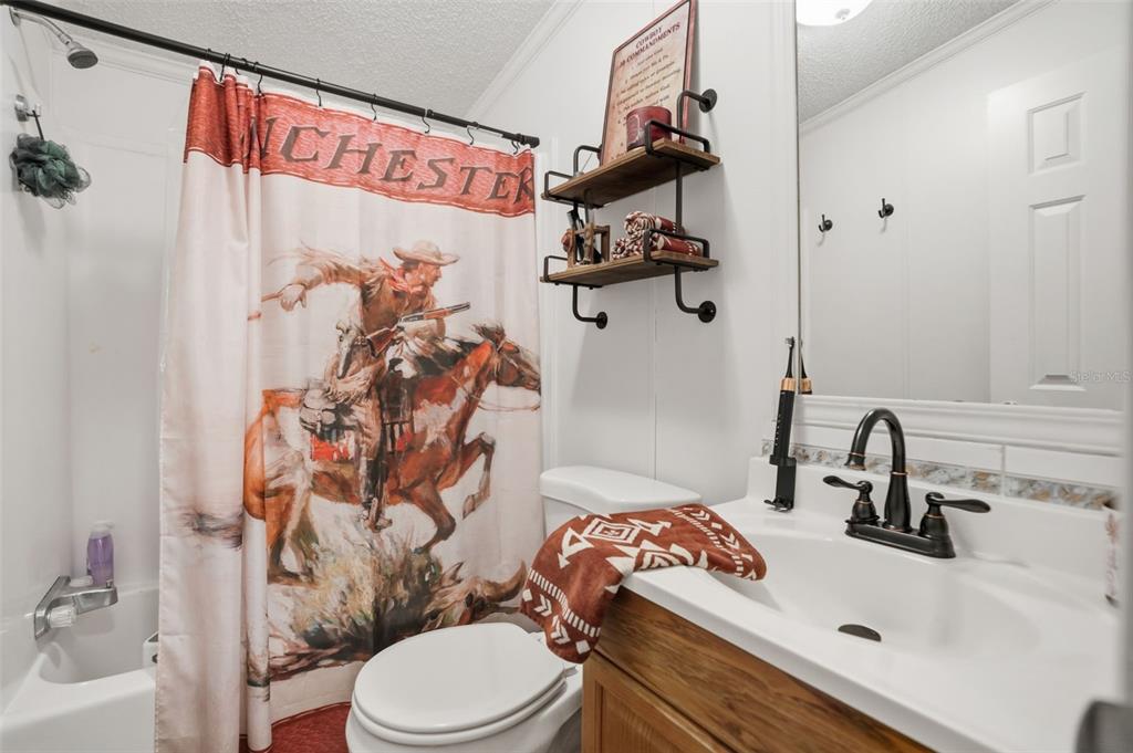 17539 Edwin Terrace Hudson, FL 34667 - Photo 29 of 38 a bathroom with a sink toilet and shower