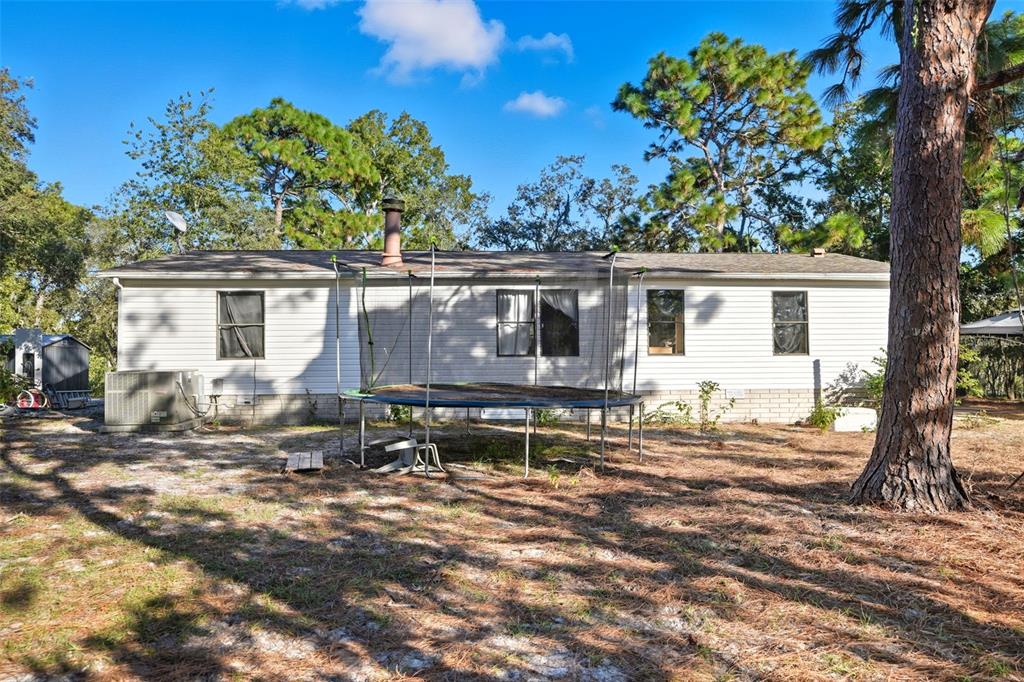 17539 Edwin Terrace Hudson, FL 34667 - Photo 33 of 38 a house view with a backyard space