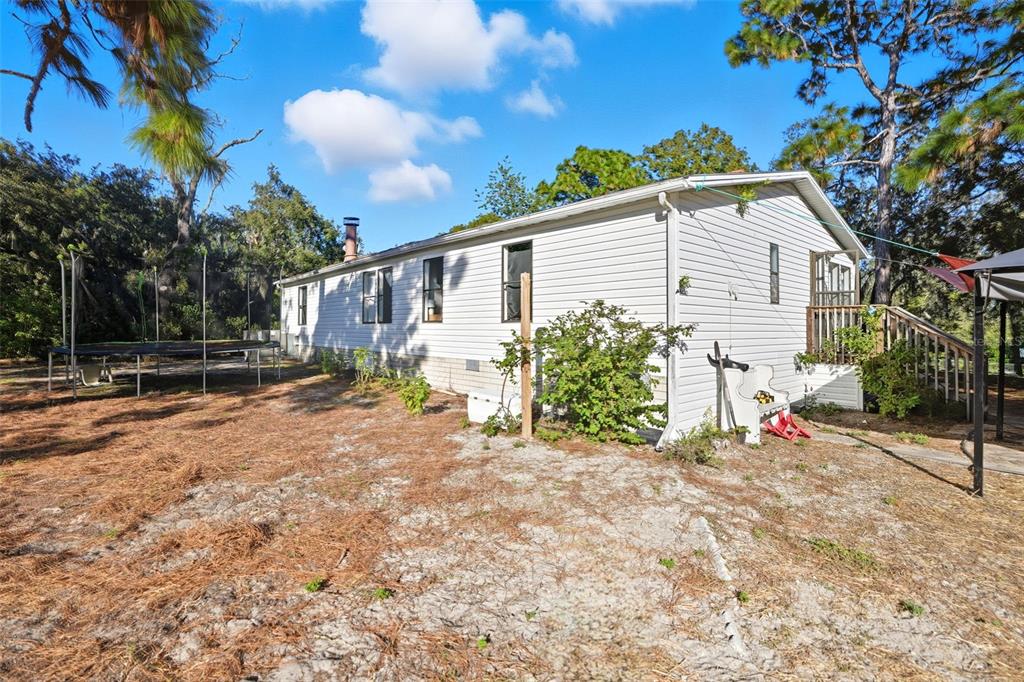 17539 Edwin Terrace Hudson, FL 34667 - Photo 34 of 38 a view of backyard with a patio