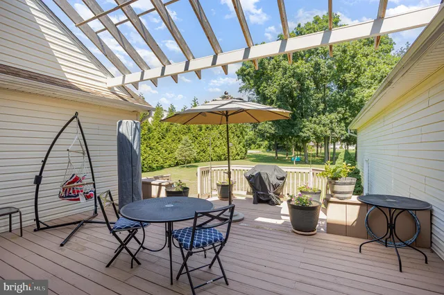 a view of a chairs and table in the patio