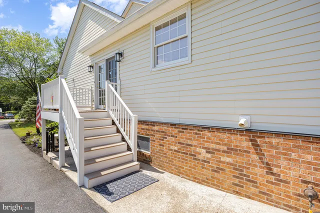 a view of wooden house with large windows