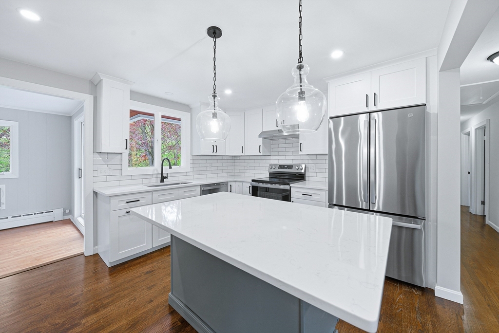 1 Ayrshire Road Worcester, MA 01604 - Photo 7 of 41 a kitchen with a refrigerator a sink and wooden floor