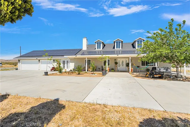 a view of a building and car parked on the road