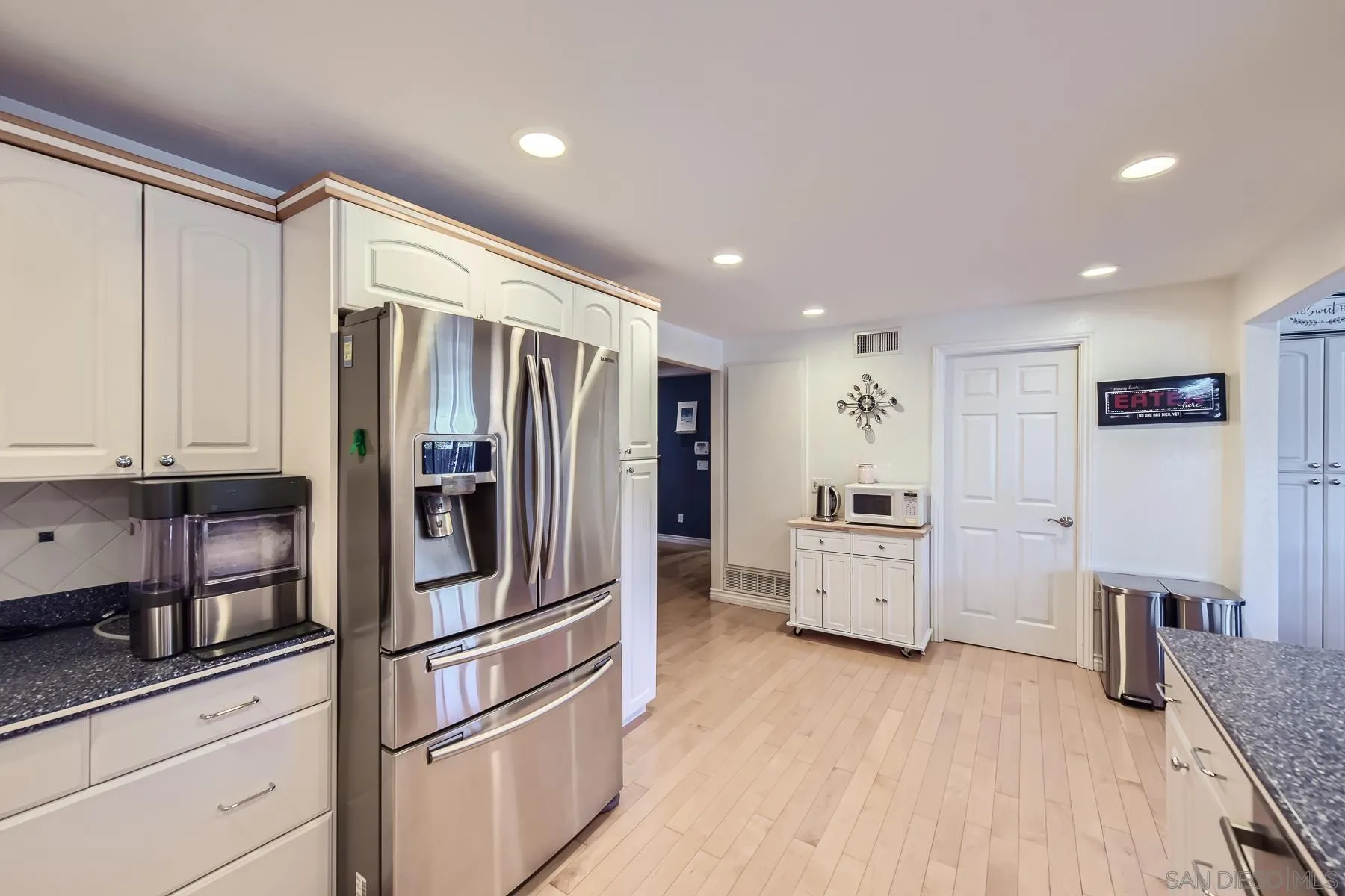 8510 Rumson Drive Santee, CA 92071 - Photo 11 of 26 a kitchen with stainless steel appliances a refrigerator sink and cabinets