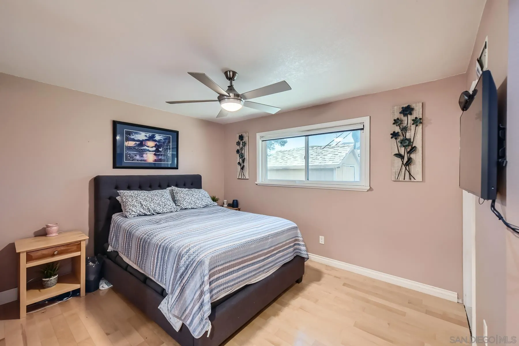 8510 Rumson Drive Santee, CA 92071 - Photo 14 of 26 a bedroom with a large bed a flat tv screen and a dresser