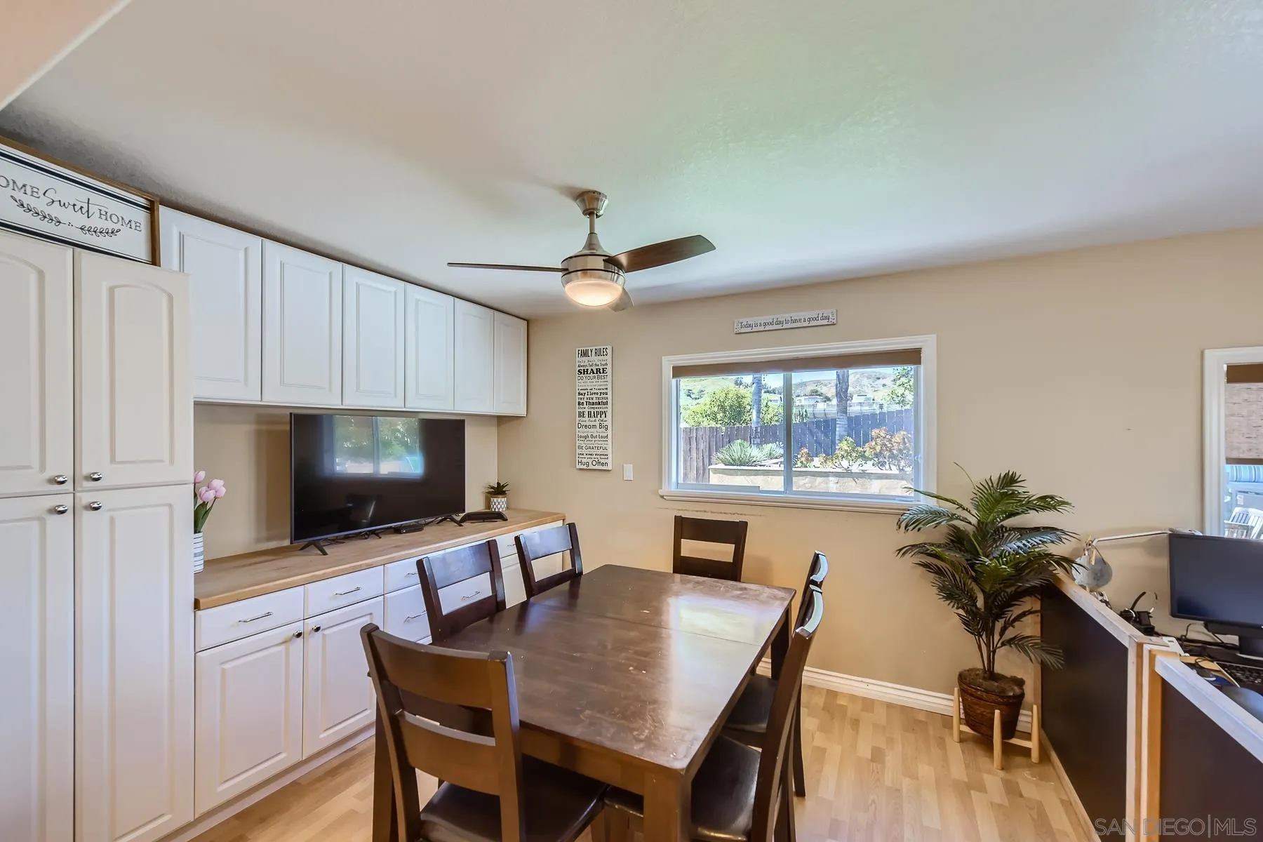8510 Rumson Drive Santee, CA 92071 - Photo 17 of 26 a view of a dining room with furniture window and wooden floor