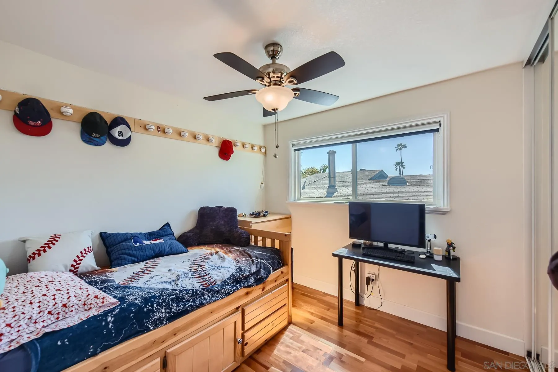 8510 Rumson Drive Santee, CA 92071 - Photo 18 of 26 a bedroom with a bed and a chandelier