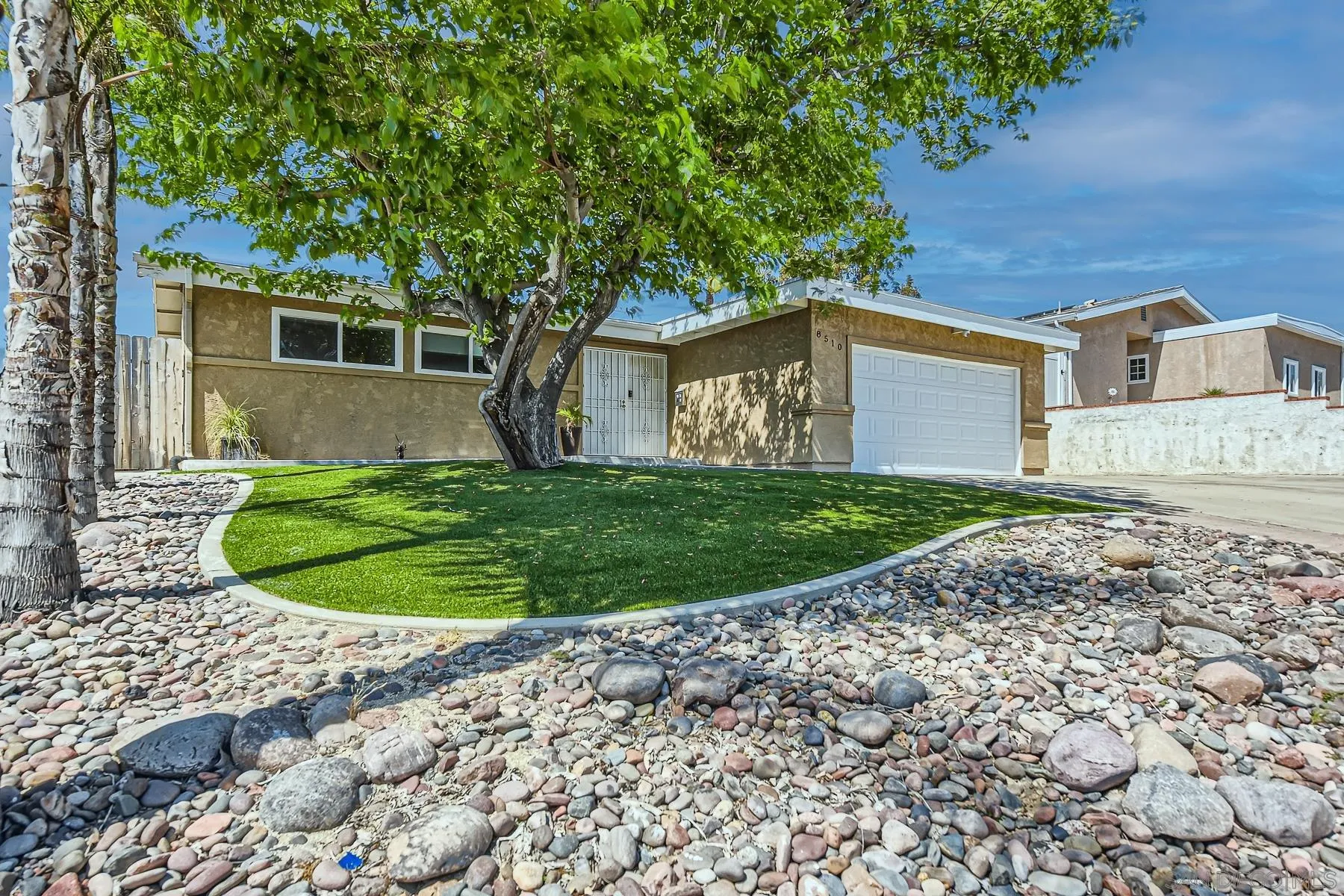 8510 Rumson Drive Santee, CA 92071 - Photo 2 of 26 a front view of a house with a yard