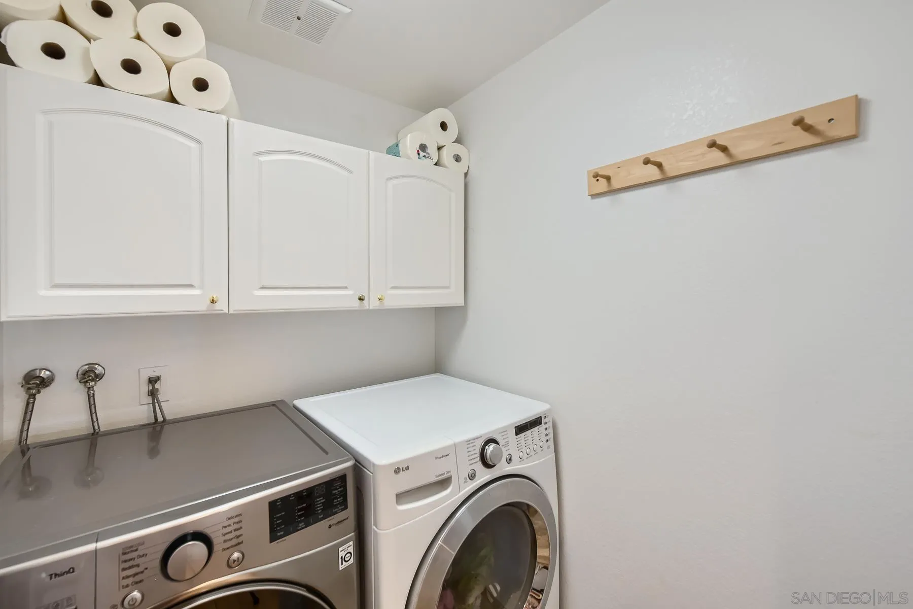8510 Rumson Drive Santee, CA 92071 - Photo 22 of 26 a utility room with dryer and washer