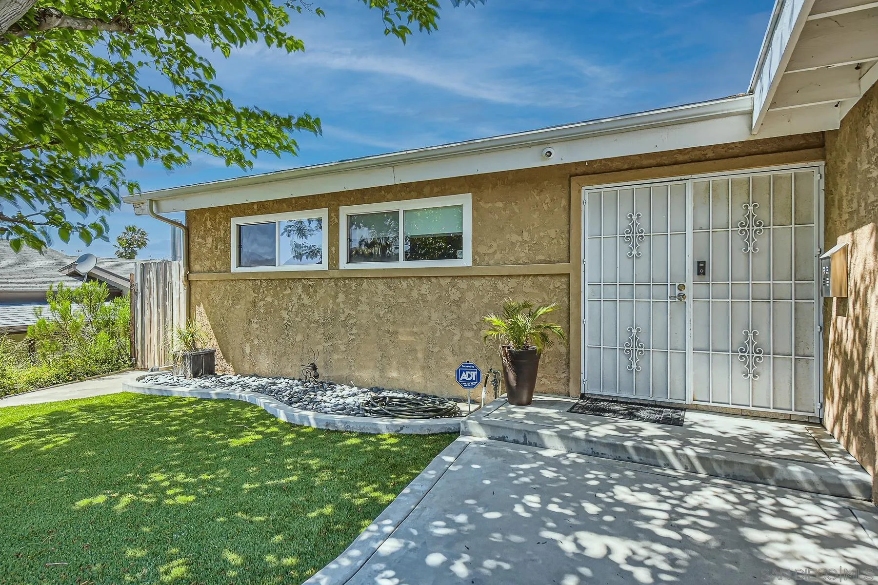 8510 Rumson Drive Santee, CA 92071 - Photo 3 of 26 a front view of a house with a yard