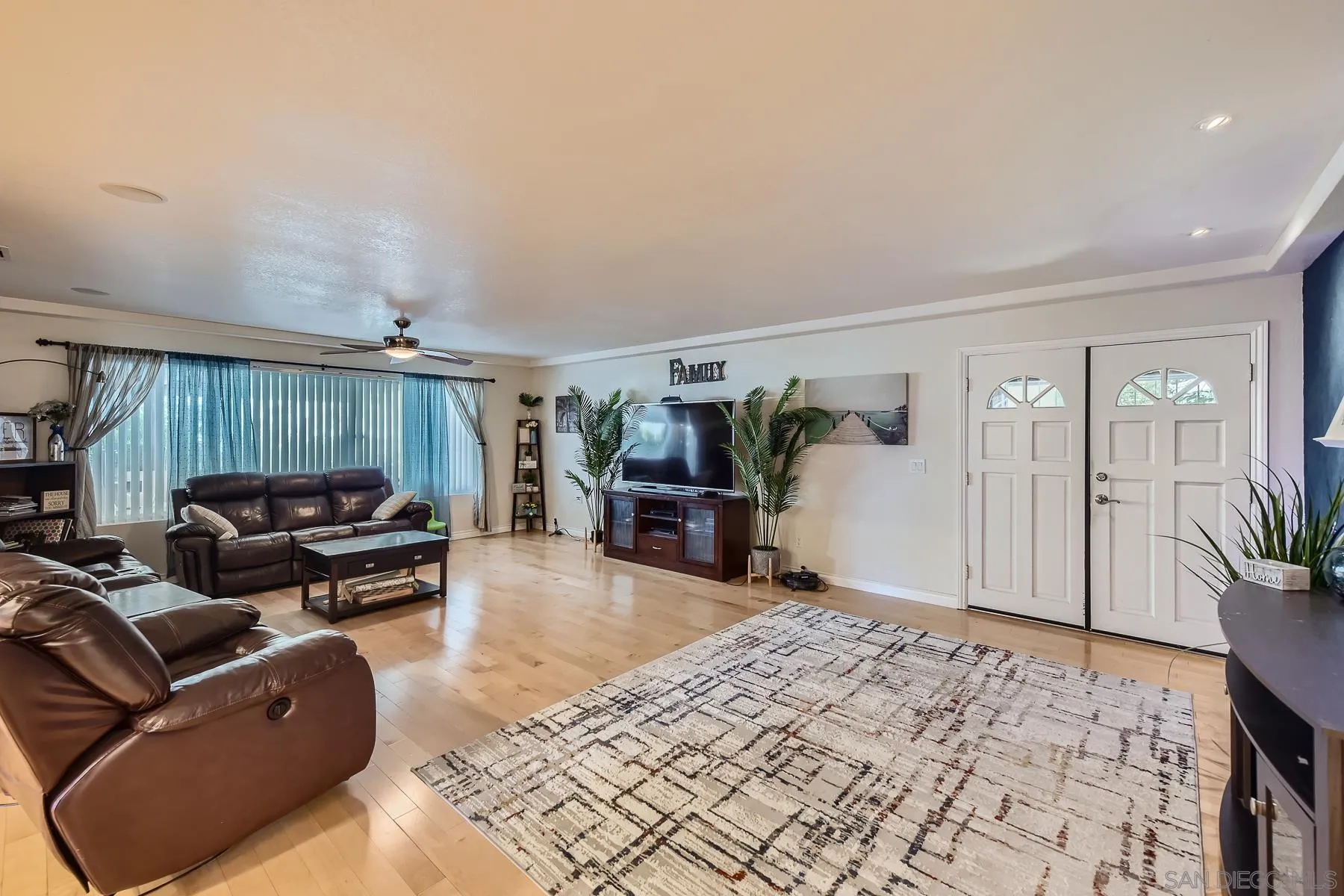 8510 Rumson Drive Santee, CA 92071 - Photo 7 of 26 a living room with furniture a ceiling fan and a rug