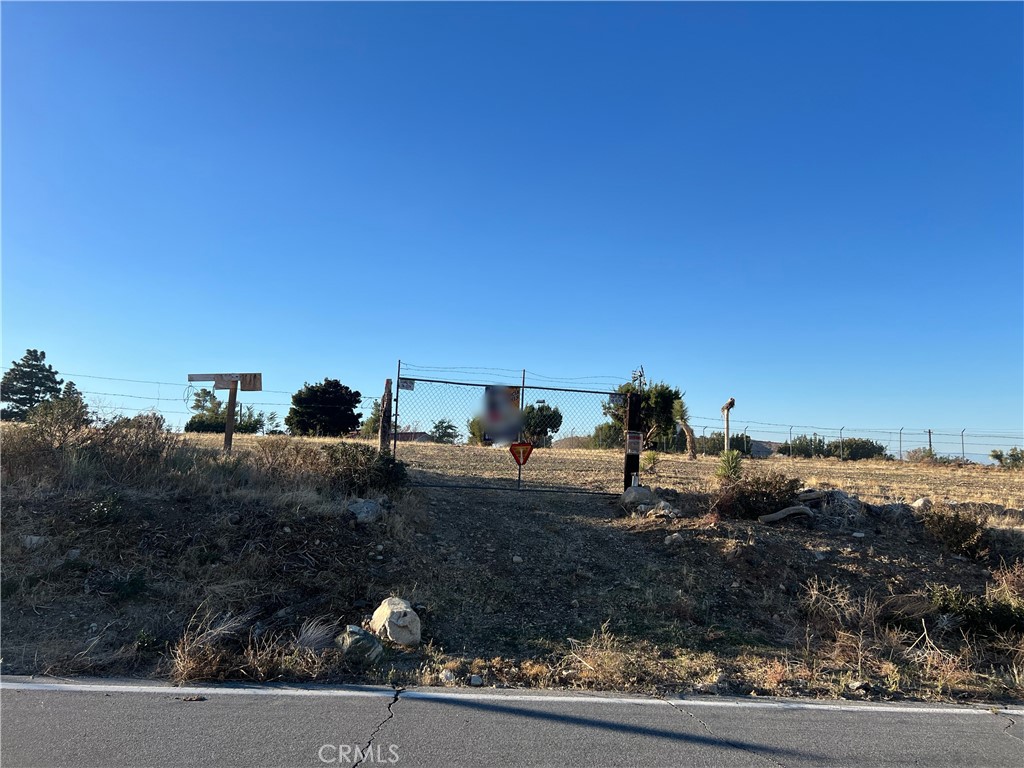 0 Vac/longview Rd/vic Murphys Road Juniper Hills, CA 93543 - Photo 7 of 20 a view of a dry yard with wooden fence