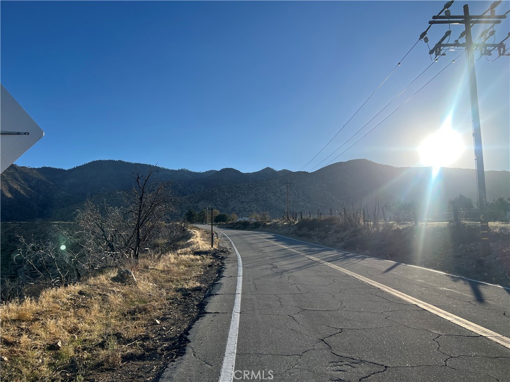 0 Vac/longview Rd/vic Murphys Road Juniper Hills, CA 93543 - Photo 8 of 20 a view of a street with a yard