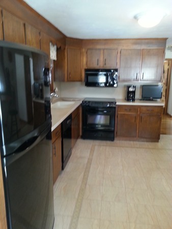 5 Governor Carver Road Billerica, MA 01821 - Photo 6 of 27 a kitchen with stainless steel appliances granite countertop a refrigerator a stove top oven a sink and dishwasher