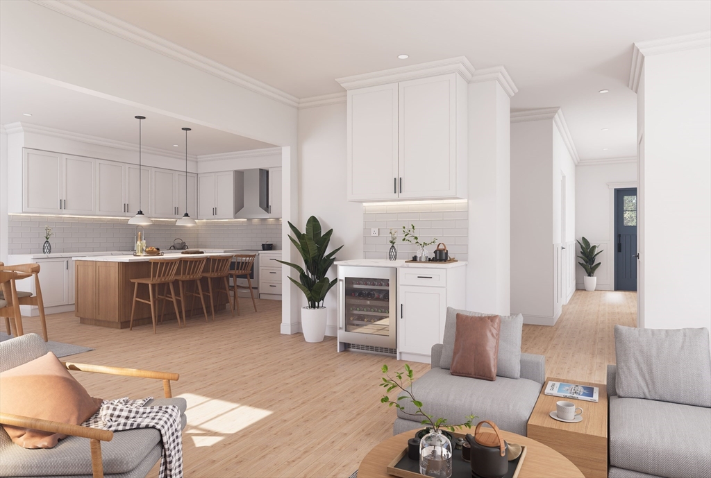 11 Whitman Circle, Unit 11 Bellingham, MA 02019 - Photo 2 of 19 a living room with furniture and a kitchen view