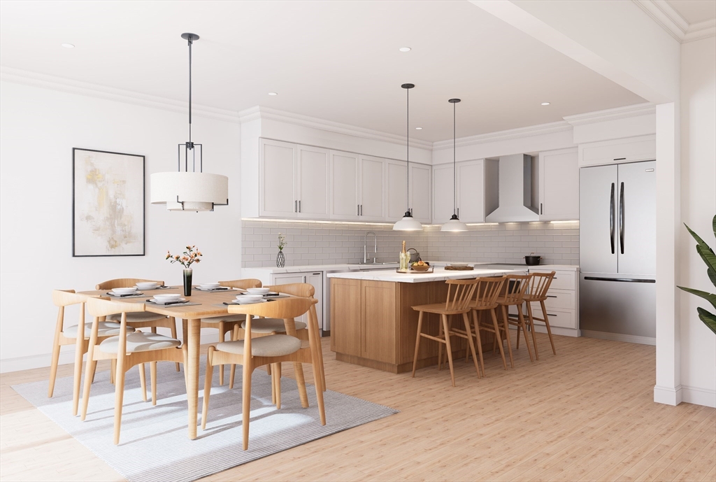 11 Whitman Circle, Unit 11 Bellingham, MA 02019 - Photo 3 of 19 a view of kitchen with cabinets table and chairs