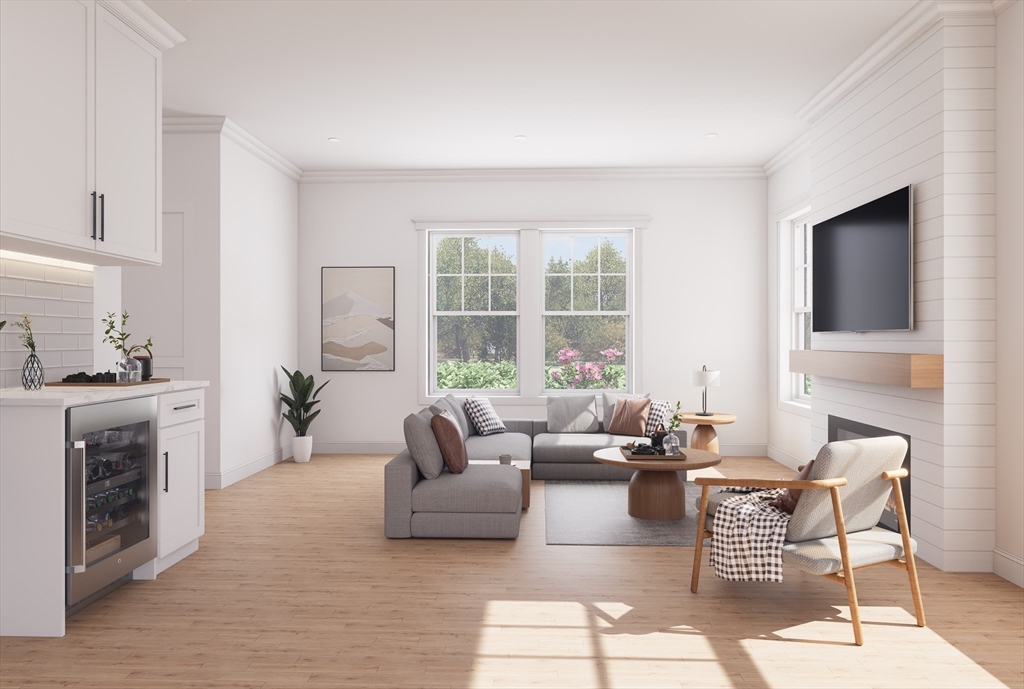 11 Whitman Circle, Unit 11 Bellingham, MA 02019 - Photo 4 of 19 a living room with fireplace furniture and a flat screen tv