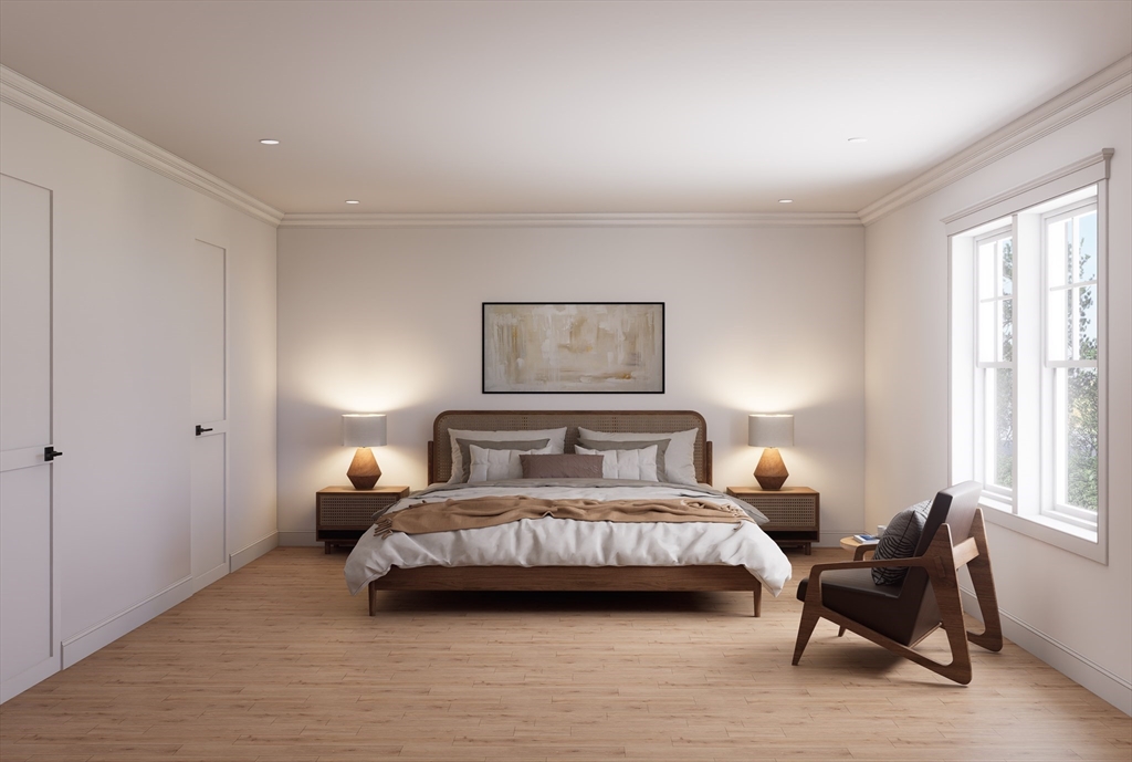 11 Whitman Circle, Unit 11 Bellingham, MA 02019 - Photo 5 of 19 a bedroom with a bed and a large window