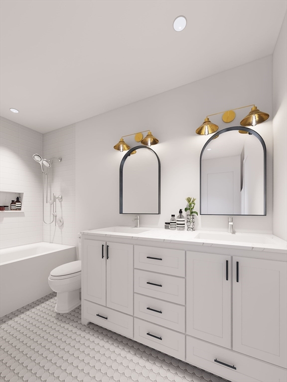 11 Whitman Circle, Unit 11 Bellingham, MA 02019 - Photo 6 of 19 a bathroom with a double vanity sink toilet and a bathtub