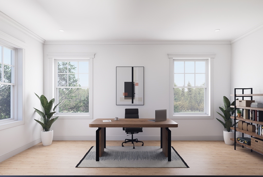 11 Whitman Circle, Unit 11 Bellingham, MA 02019 - Photo 8 of 19 a workspace with furniture and a potted plant
