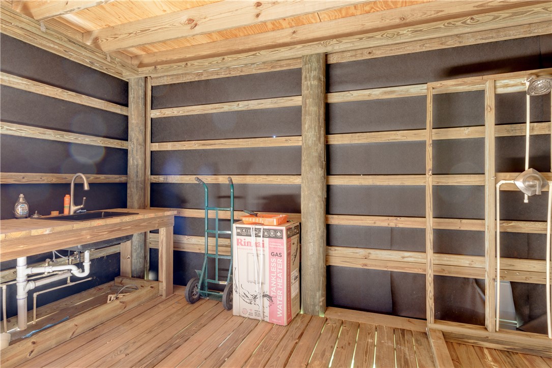 Xxxx Carlton Road Fort Pierce, FL 34945 - Photo 23 of 35 a view of a kitchen with furniture and wooden floor