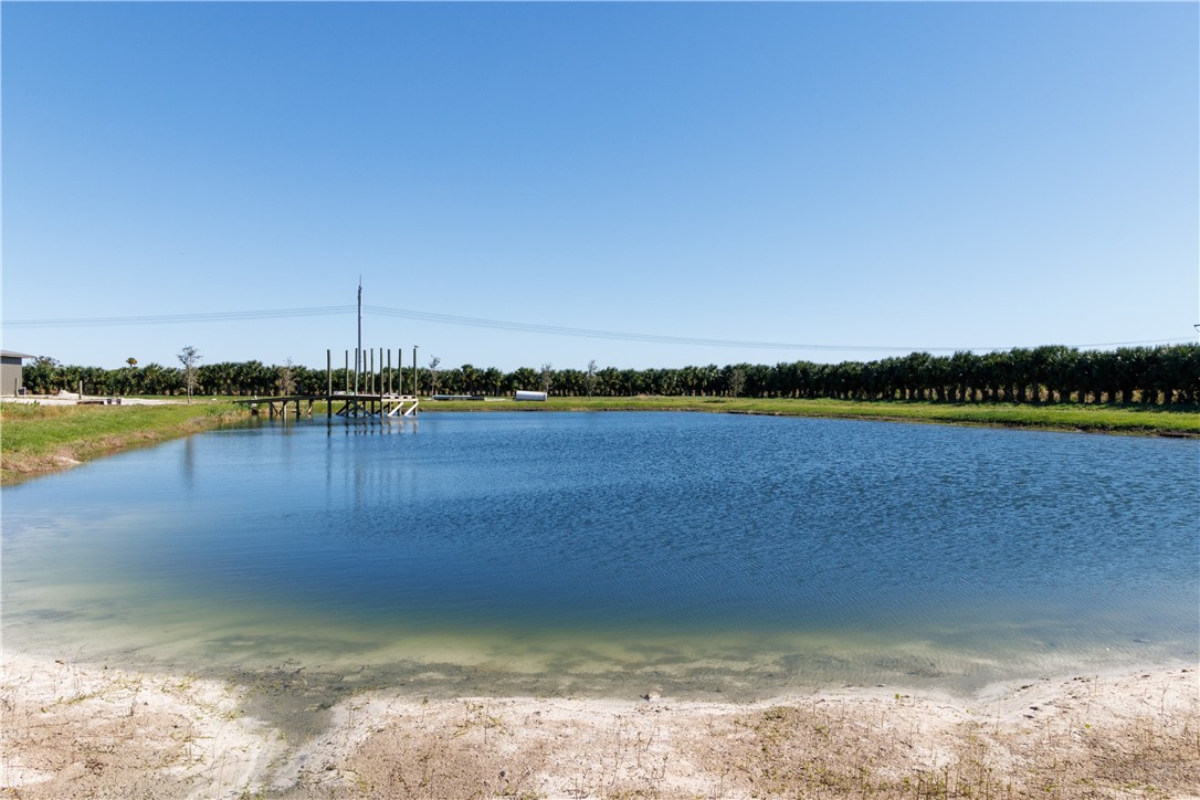 Xxxx Carlton Road Fort Pierce, FL 34945 - Photo 24 of 35 a view of a lake with houses in the background