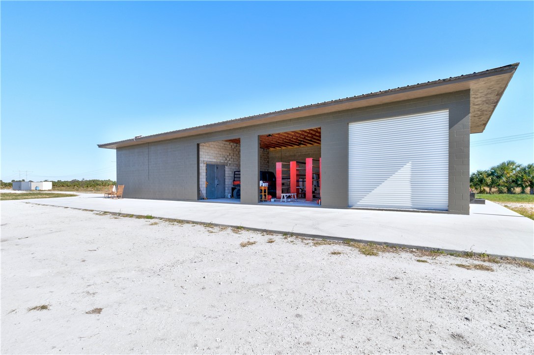 Xxxx Carlton Road Fort Pierce, FL 34945 - Photo 25 of 35 a view of wooden floor and a fence in front of house