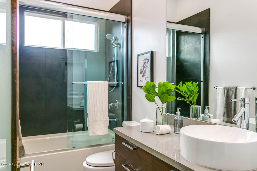 319 Camillo Road Sierra Madre, CA 91024 - Photo 14 of 40 a bathroom with a granite countertop sink toilet and shower