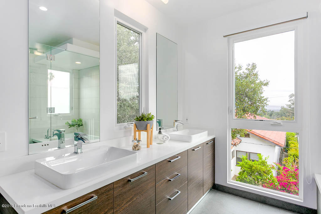 319 Camillo Road Sierra Madre, CA 91024 - Photo 25 of 40 a bathroom with a double vanity sink and a window
