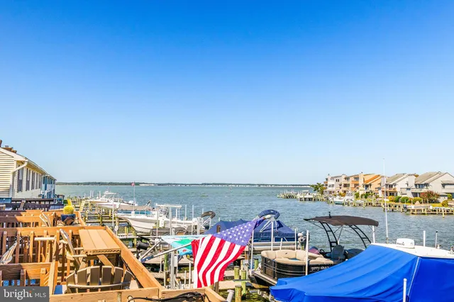 a view of roof deck with city view and ocean view