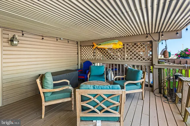 a view of a balcony with outdoor seating