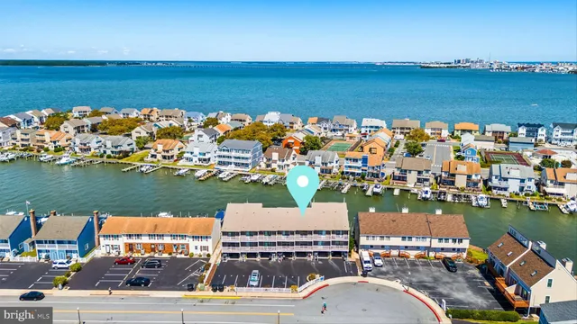 a view of a lake with a table and chairs