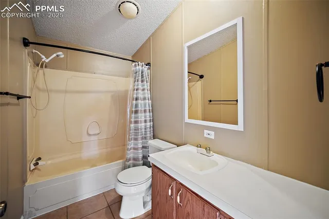a bathroom with a sink vanity mirror and toilet