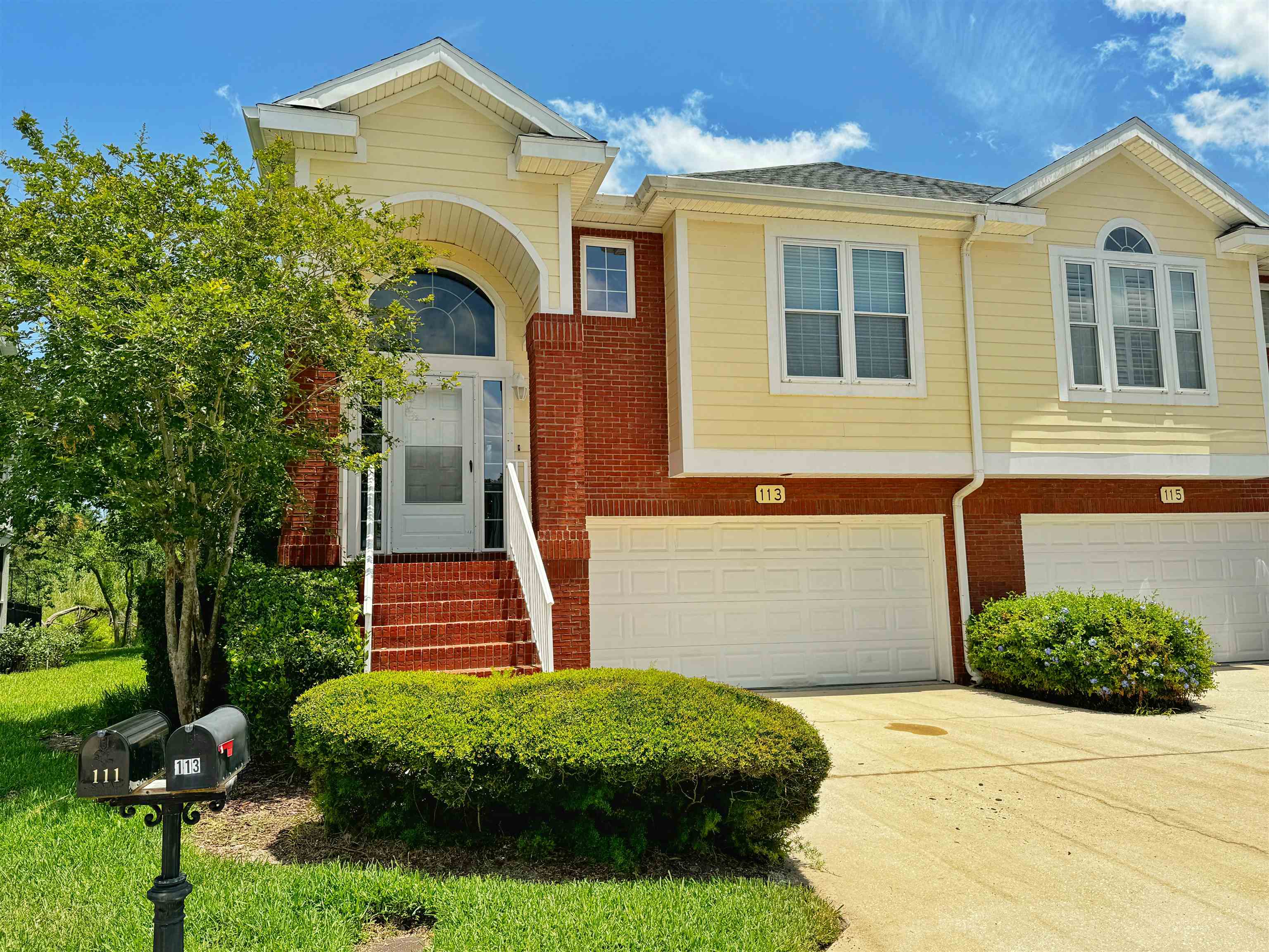 a front view of a house with garden