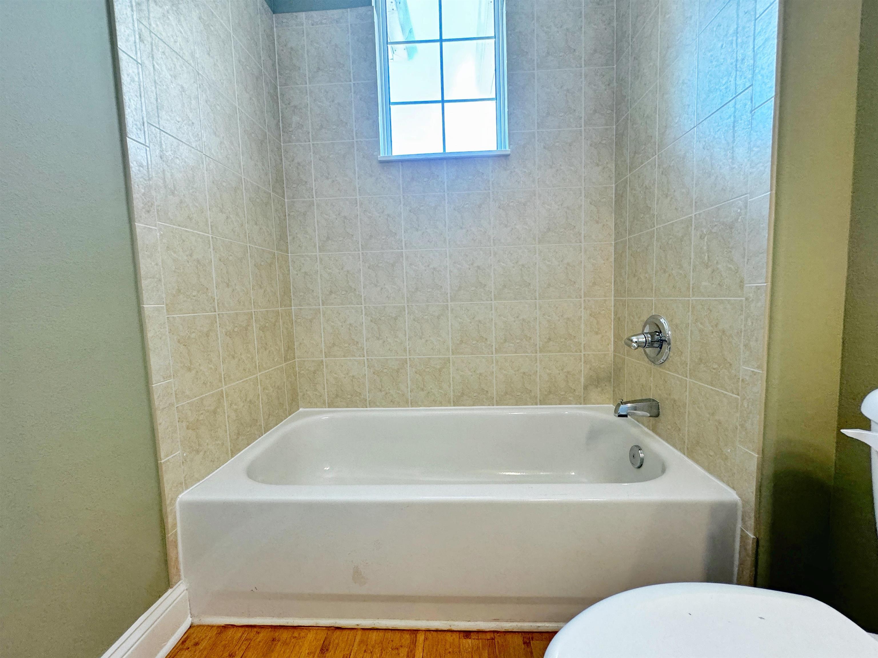 113 Sunset Circle South St. Augustine, FL 32080 - Photo 23 of 33 a white bath tub sitting next to a white toilet